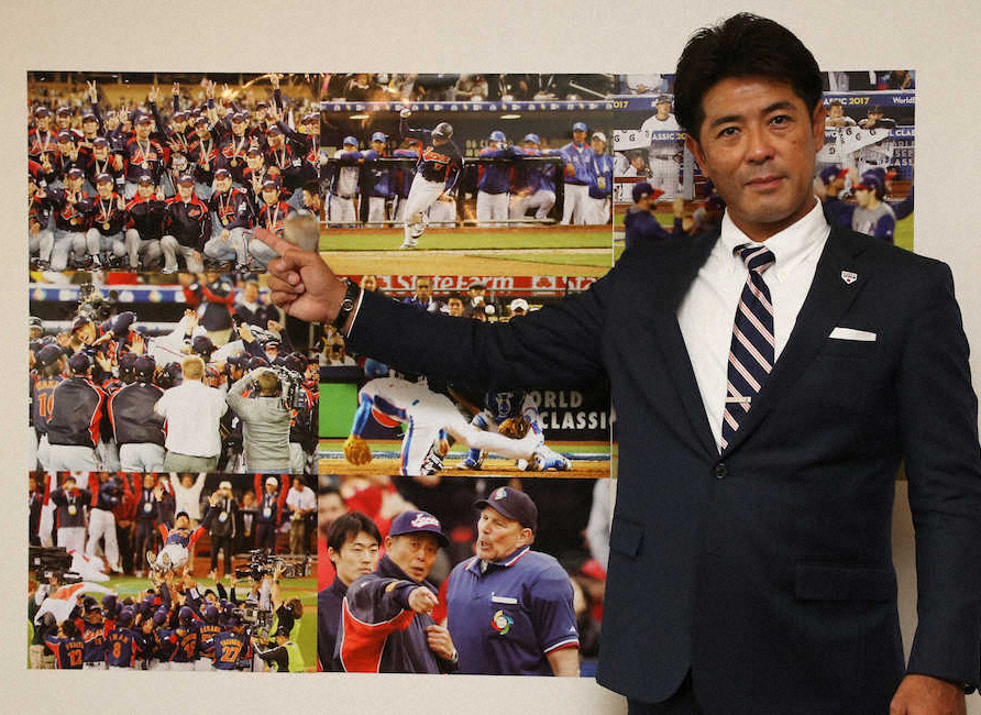 野球の日本代表の激闘を示す写真の前で頂点を目指すことを誓った稲葉監督（撮影・西海健太郎）